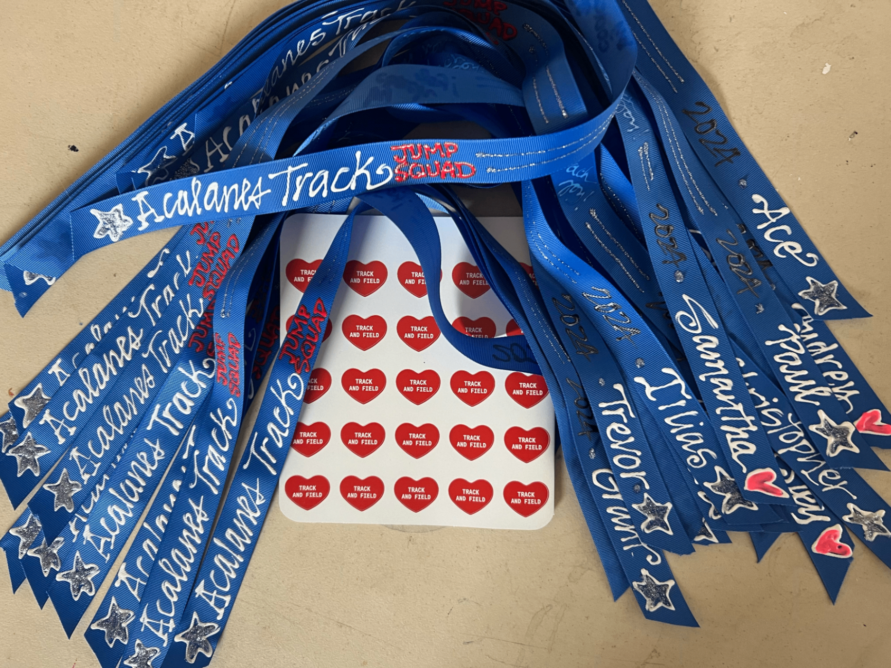 Blue hand painted Jackrabbits ribbons personalized with children's names, stars and hearts